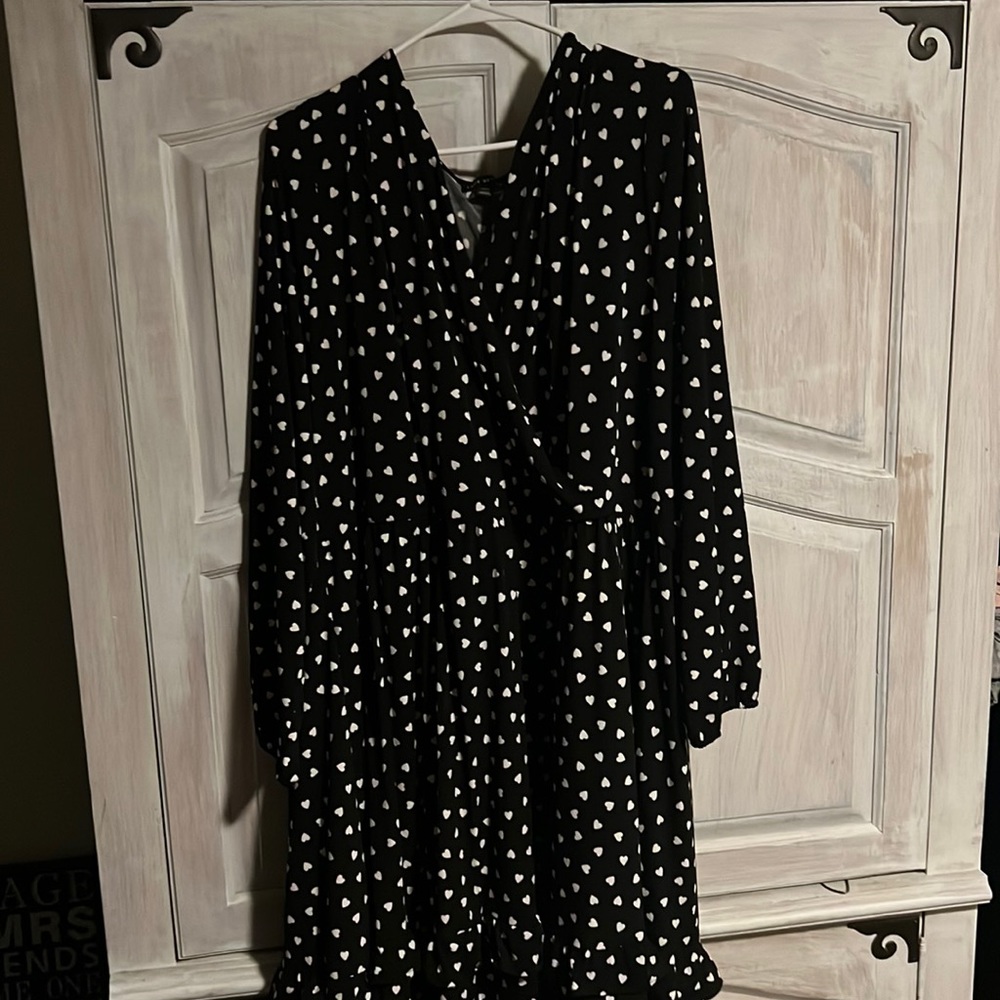 Do not fit.  Thick material dress. Black with white hearts.